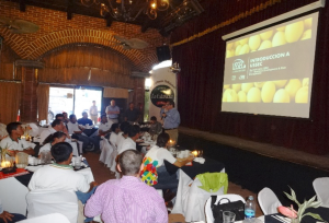 USSEC Consultant Gerardo Luna talks about USSEC and commodity markets during a seminar in Guatemala