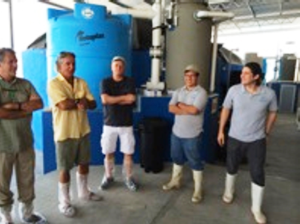 USSEC Americas Regional Director Francisco de la Torre (second from left) is shown  during a visit to a hatchery in Mexico