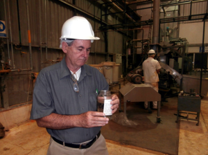 USSEC consultant Mark Newman inspects a feed sample produced at a Mexican feed mill