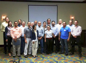 USSEC Americas Regional Director and consultants pose with purchasing process seminar attendees in the Dominican Republic