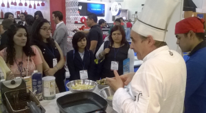 Chef Giuseppe de Pascuale explains how to prepare foods using soybean products in the USSEC booth during the Abastur Trade Show in Mexico