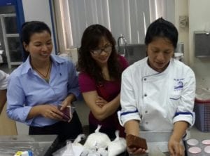 Interflour 5593:  (From left):  Hoang Thi Lan Phuong, Interflour Sales and Marketing Manager; Nguyen Ngan Hanh, USSEC Vietnam; Chef Jill