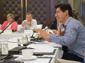 Alex Utida, Director of the Brazilian Soya Association, talks with other members of the IGSA about meetings conducted with the State Administration of Grain in China. Utida, like other members of the ISGA, relayed his frustrations of the slow biotech approval process in China and how new technology is needed to have better and more effective weed and insect control to produce quality soybeans at a lower price.