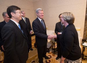 Laura Foell, chairman of USSEC, greets U.S. Ambassador Max Baucus before the start of the 2015 Forum on Biotechnology and Global Soy Trade. Baucus and ambassadors from Argentina, Brazil and Uruguay spoke to those in attendance.