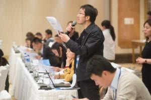 An audience members asks a question during the 2015 Forum on Biotechnology and Global Soy Trade.