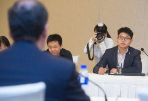Members of the Chinese media talk to representatives of the International Soy Growers Alliance at the conclusion of the 2015 Forum on Biotechnology and Global Soy Trade.