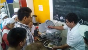 USSEC consultants Oliverio Cruz showing how to prepare dough with U.S. soybean ingredients at the baking workshop in Morelia, Mexico