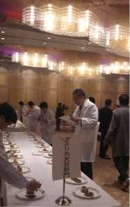 Yoshihiro Noro, chairman of Japan Natto Cooperative Society, judges 24 natto products entered into the U.S. Soy category