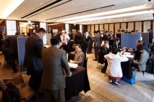 U.S. exporters and their Korean representatives talk with Korean food-bean importers during the tabletop trade show.