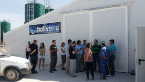 The international group visits a newly built broiler house at Caceres