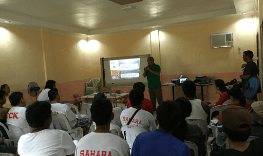 USSEC Philippines Technical Manager-Aquaculture Levy Manalac presents the USSEC Floating Feed Feeding Management in Cage Aquaculture to the managers, farm technicians and feed managers of Southeast/Sahara Feeds Corp. Cage Farm in Taal Lake, Talisay, Batangas, Philippines