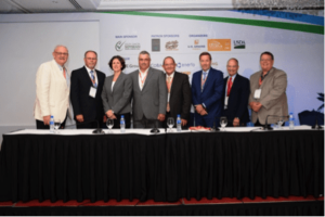 Day 1 (AM Session) Panel Session (L-R) USB director David Williams; ASA director Monte Peterson; USSEC Marketing Director – Market Access/FTO Rosalind Leeck; David Adams, Wisconsin Corn Growers Association; Peter Lloyd, U.S. Wheat Associates; David Hightower, The Hightower Report; Thomas Hammer, National Oilseed Processors Association; and Keith Schrader, MSR&PC