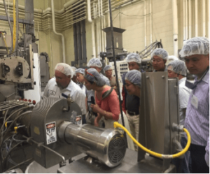 Dr. Eric Michael, from KSU’s IGP program demonstrates how to produce extruded soybean product