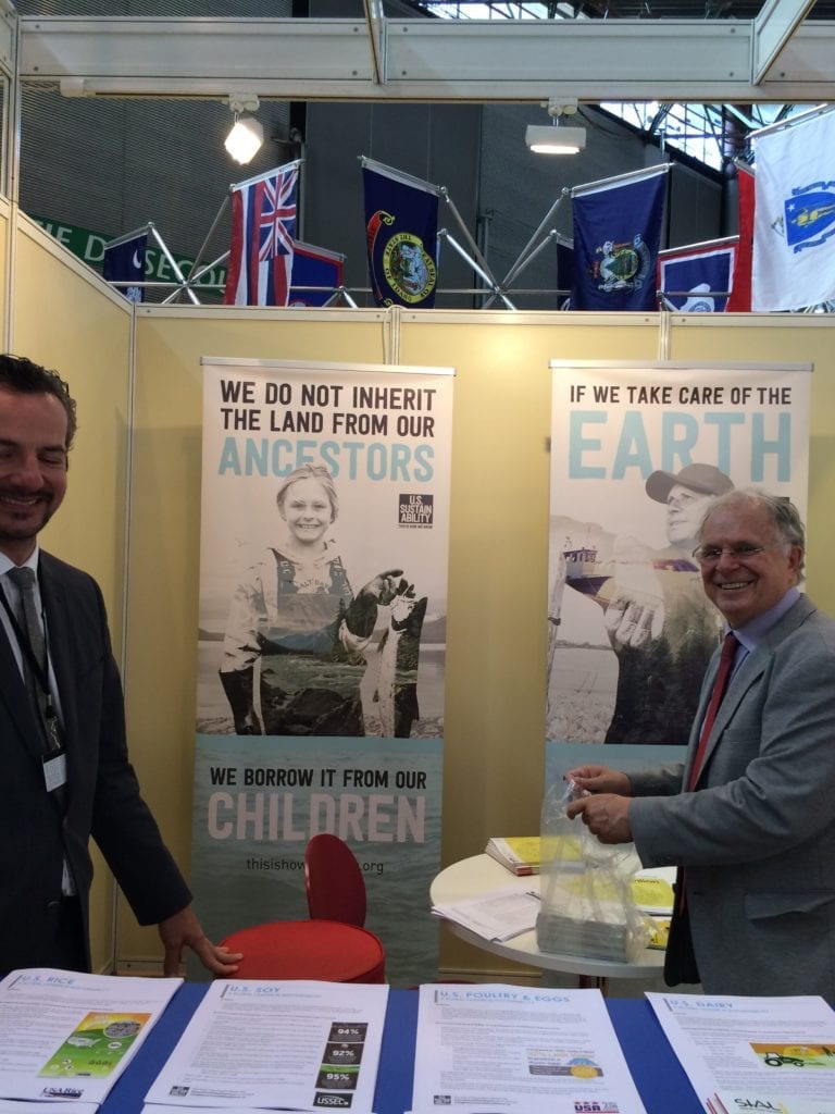 David Green and Laurent Journo of FAS Paris tend to the USDA booth at SIAL Paris 2016. USSA's pop-up posters are prominently displayed and cooperator fact sheets line the front table