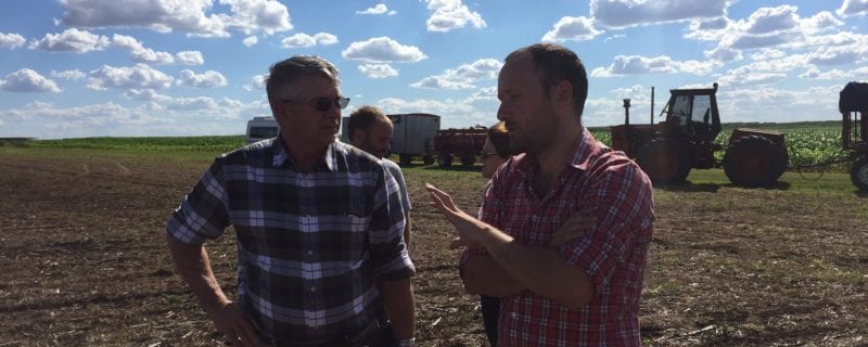 USSEC Chairman Jim Miller talks with a farmer in Argentina
