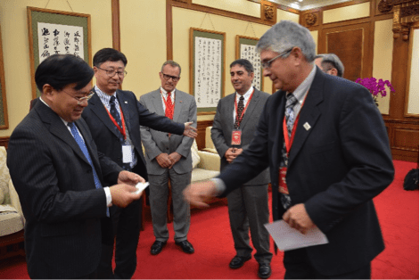 USSEC Chairman Jim Miller exchanges business cards with Han Jun before the meeting