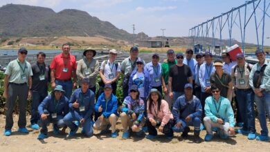 Group of people at an aquaculture facility