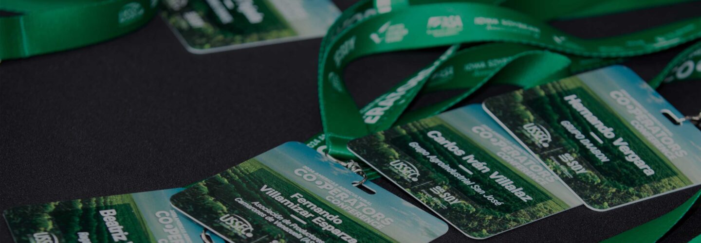 Name tags and lanyards on a meeting registration table.