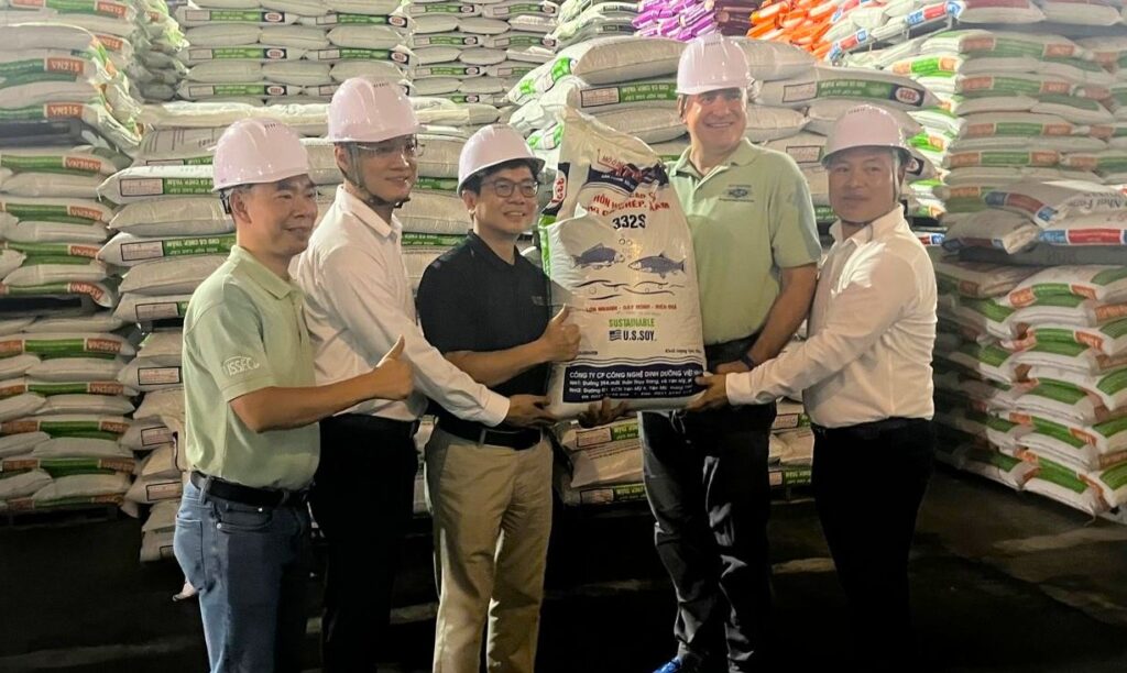Timothy Loh, USSEC Regional Director for East Asia holding a aquafeed bag.